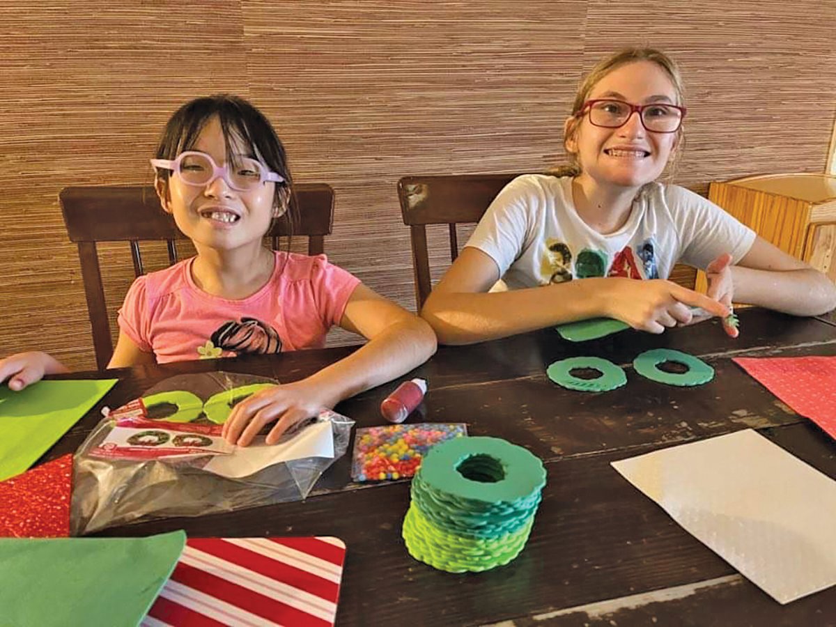 LABELLE — Tressa Pringle, who was found safely after wandering away, and her sister Zoe and make holiday cookies together under close supervision. Zoe also has PWS.
